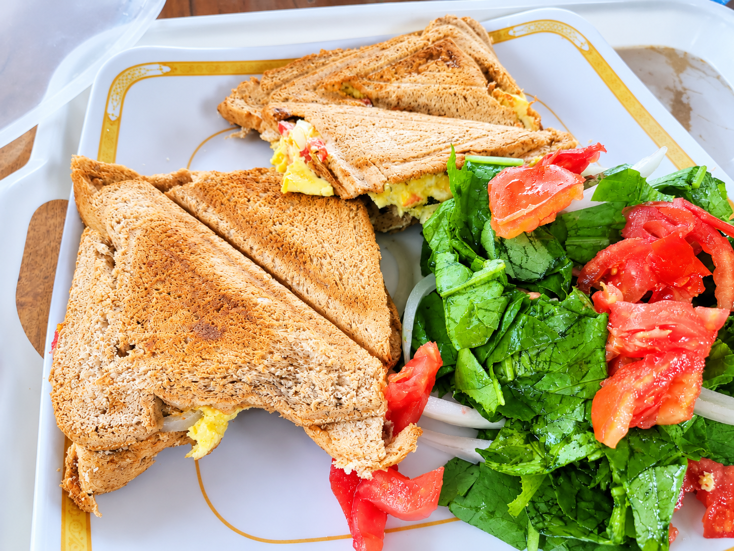 Toasted sandwich triangles with fresh salad at Tetra Jungle Hotel