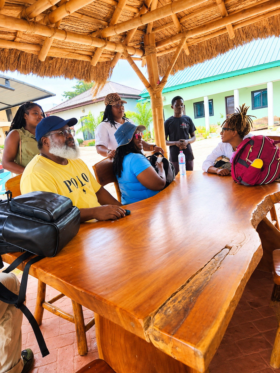 Guests gathered around a pavilion table