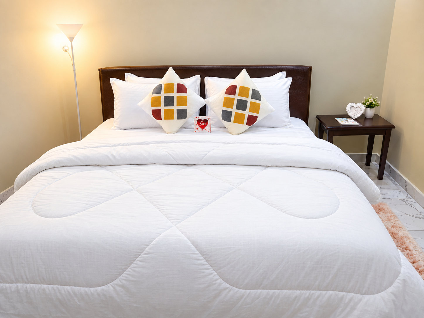 Warmly staged guest bedroom