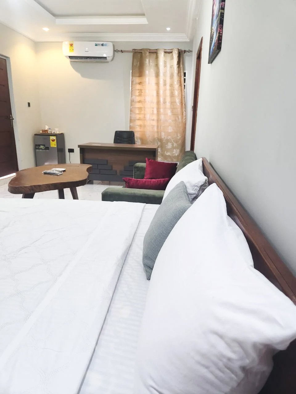 Guest bedroom with bed and seating area