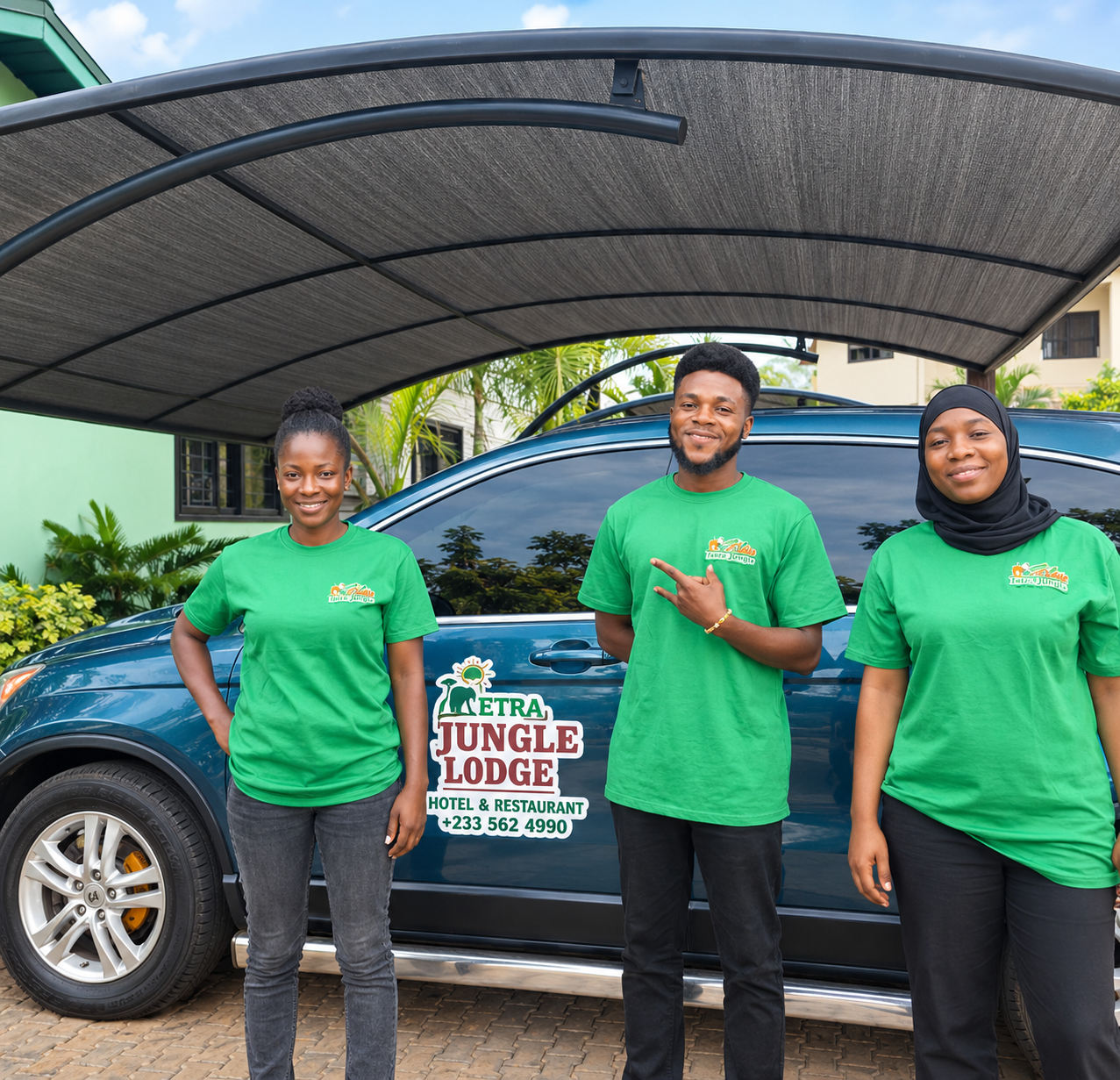 Tetra Jungle Hotel staff members standing together beside a hotel vehicle